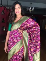 Wine Banarasi Silk Saree adorned with Beautiful Patola and Paithani Weaves