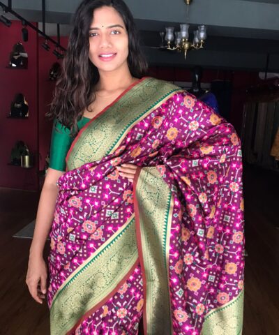 Wine Banarasi Silk Saree adorned with Beautiful Patola and Paithani Weaves