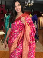 Rani Pink Banarasi Silk Saree adorned with Beautiful Patola and Paithani Weaves