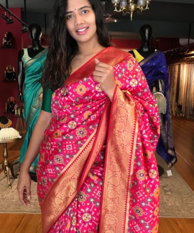 Rani Pink Banarasi Silk Saree adorned with Beautiful Patola and Paithani Weaves