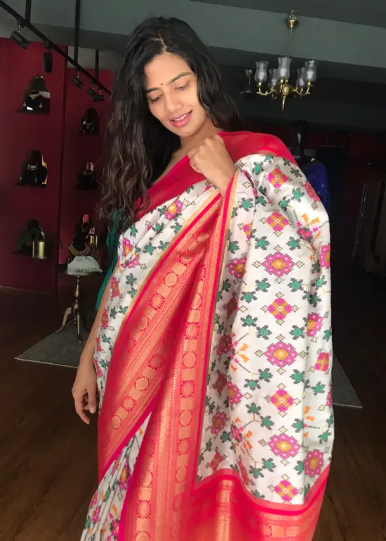 White Banarasi Silk Saree adorned with Beautiful Patola Weaves