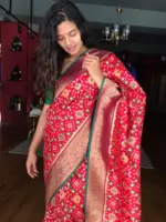 Red Banarasi Silk Saree adorned with Beautiful Patola and Paithani Weaves