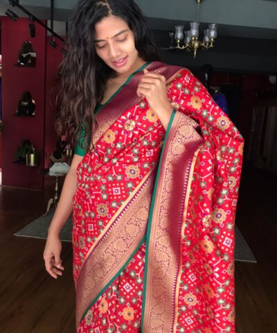 Red Banarasi Silk Saree adorned with Beautiful Patola and Paithani Weaves