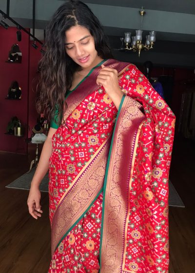 Red Banarasi Silk Saree adorned with Beautiful Patola and Paithani Weaves