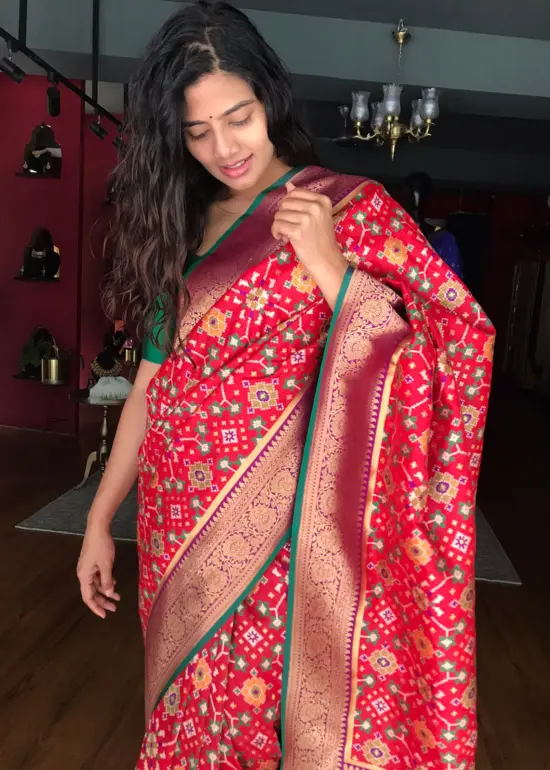 Red Banarasi Silk Saree adorned with Beautiful Patola and Paithani Weaves
