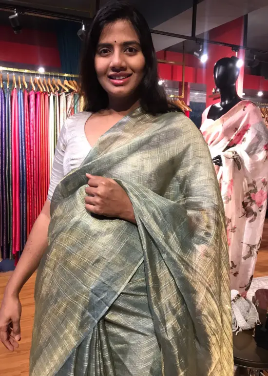 Sea Green Tissue Tussar Silk Saree highlighted with Silver Zari Checks