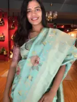 Pastel Green Muga Silk Saree with Beautiful Meenakari Weaves highlighted with Gold Zari