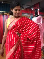 Red Banarasi Silk Saree highlighted with Leheriya Weaves