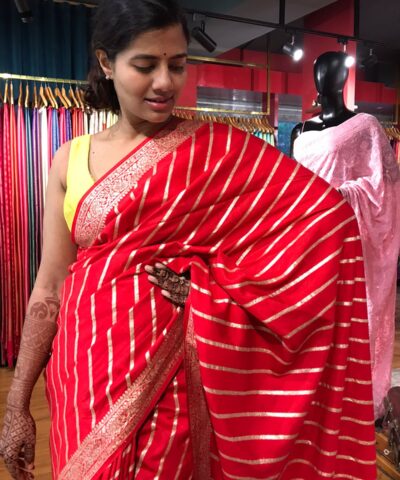 Red Banarasi Silk Saree highlighted with Leheriya Weaves