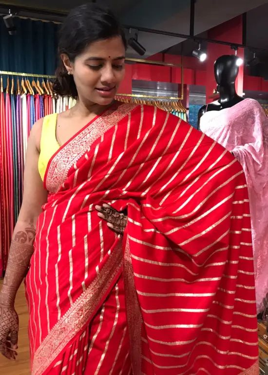 Red Banarasi Silk Saree highlighted with Leheriya Weaves