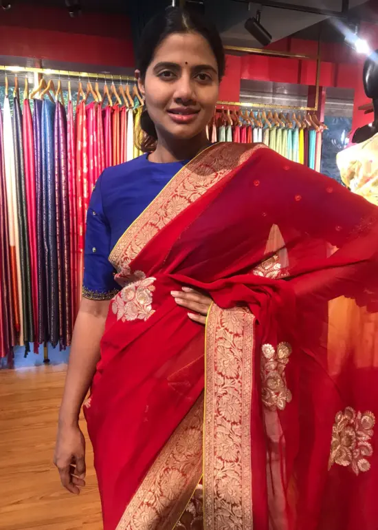 Red Banarasi Silk Saree in Georgette highlighted with Woven Zari Buttas