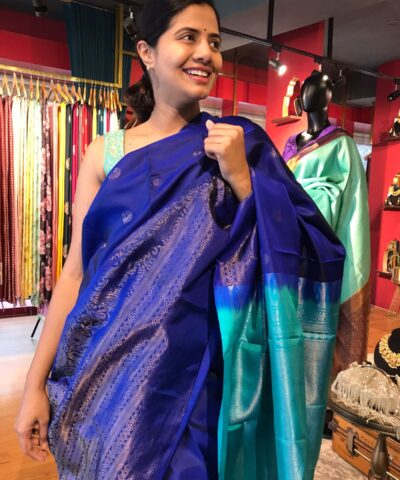 Royal Blue Kanjivaram Silk Saree with Handwoven Silver Zari Buttas and woven Border