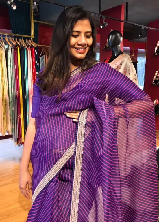 Purple Leheriya Organza Silk Saree highlighted with Hand Embroidered Border