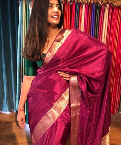 Dark Magenta Dola Silk Saree highlighted with Gold Zari Border