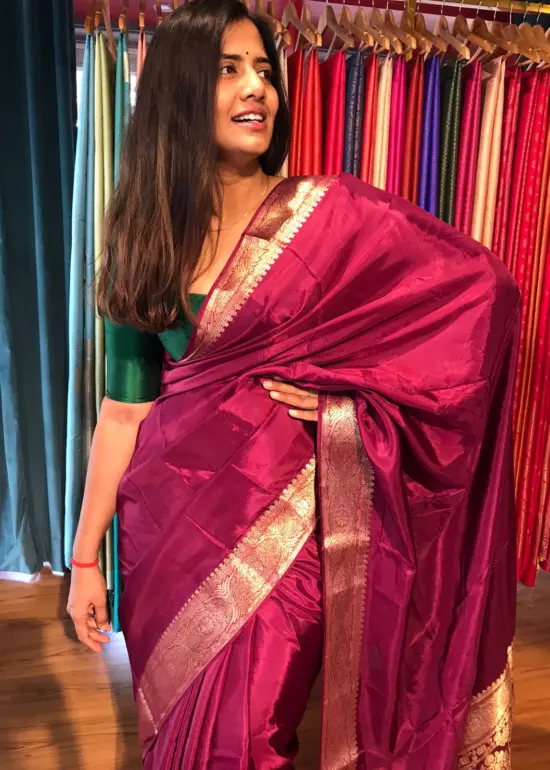 Dark Magenta Dola Silk Saree highlighted with Gold Zari Border