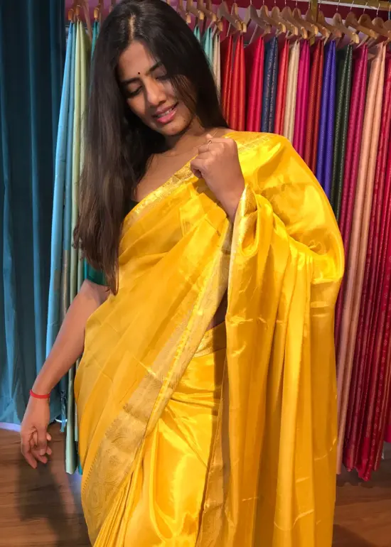 Golden Yellow Dola Silk Saree highlighted with Gold Zari Border