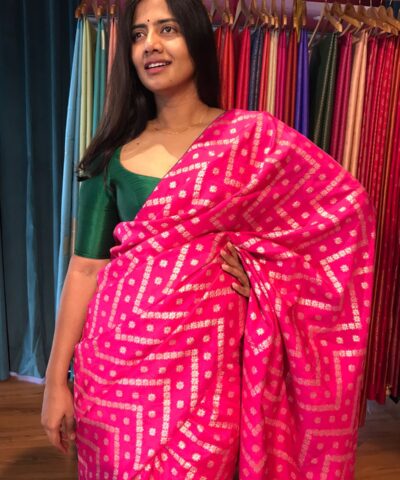 Rani Pink Dola Silk Saree highlighted with Zari Weaves