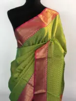 Green kora Silk Saree highlighted with zari weaves