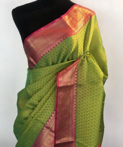 Green kora Silk Saree highlighted with zari weaves