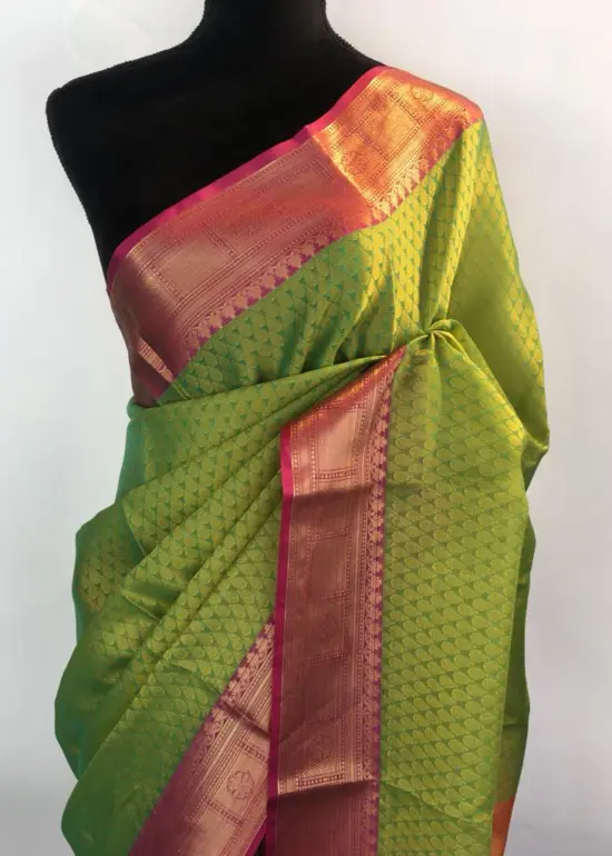 Green kora Silk Saree highlighted with zari weaves