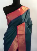Peacock blue kora Silk Saree highlighted with zari weaves