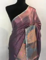 Purple Green Kora Silk Saree highlighted with zari weaves