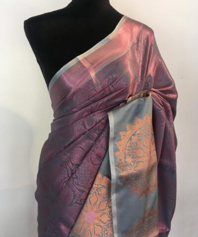 Purple Green Kora Silk Saree highlighted with zari weaves