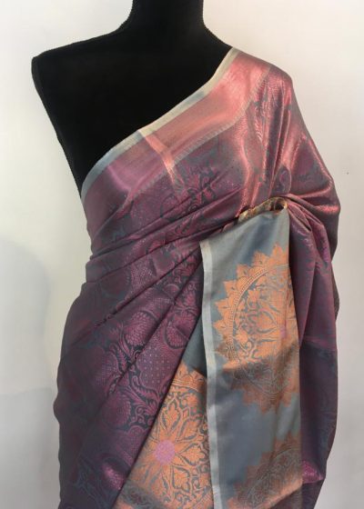 Purple Green Kora Silk Saree highlighted with zari weaves