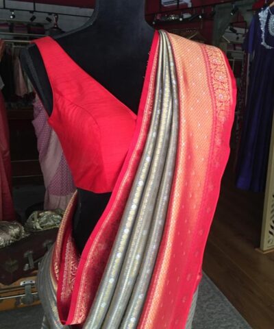 Grey Banarasi Silk Saree highlighted with gold and silver zari weaves