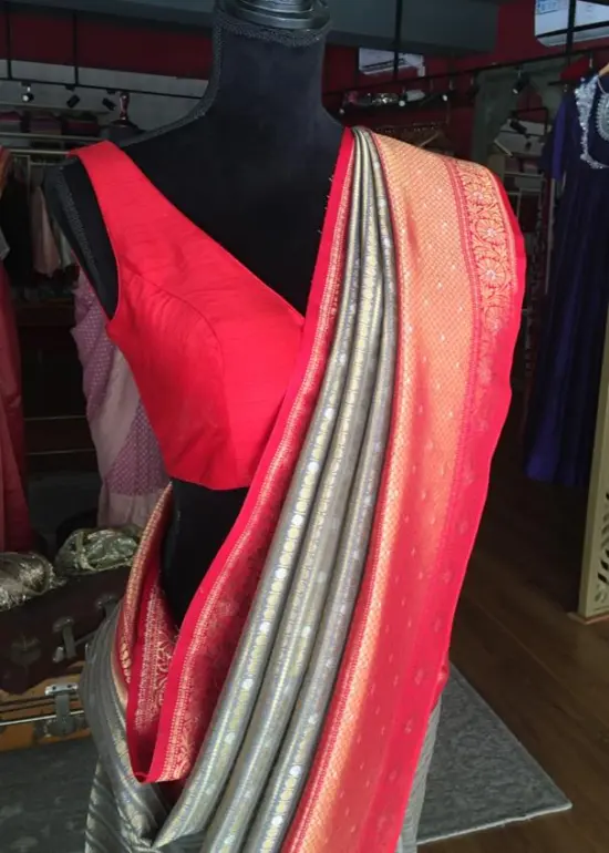 Grey Banarasi Silk Saree highlighted with gold and silver zari weaves