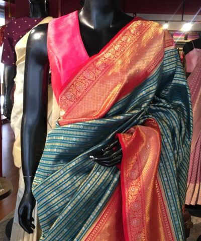 Aqua Blue Banarasi Silk Saree highlighted with gold and silver zari weaves