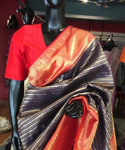 Navy Blue Banarasi Silk Saree highlighted with gold and silver zari weaves