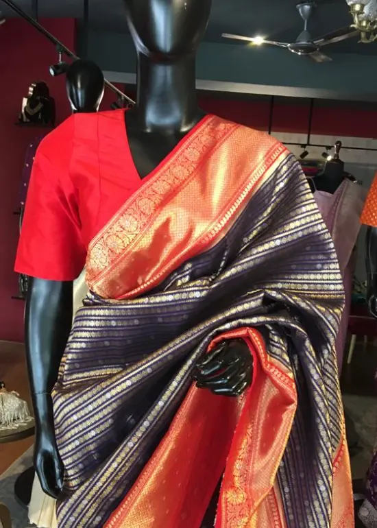 Navy Blue Banarasi Silk Saree highlighted with gold and silver zari weaves