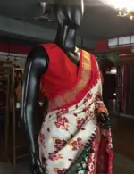 Offwhite Banarasi Soft Silk Saree highlighted with Patola Weaves