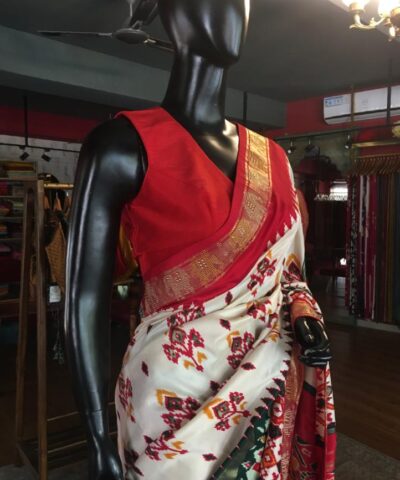 Offwhite Banarasi Soft Silk Saree highlighted with Patola Weaves