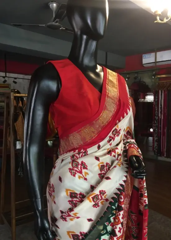 Offwhite Banarasi Soft Silk Saree highlighted with Patola Weaves