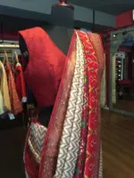 Offwhite Banarasi Soft Silk Saree highlighted with Patola Weaves