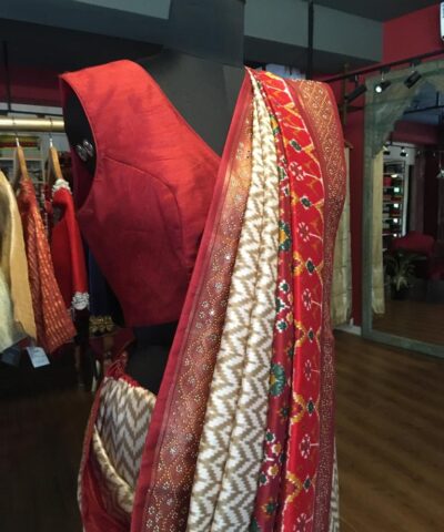 Offwhite Banarasi Soft Silk Saree highlighted with Patola Weaves