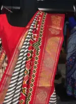Offwhite Banarasi Soft Silk Saree highlighted with Patola Weaves