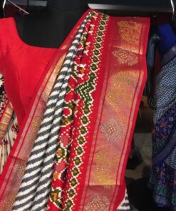 Offwhite Banarasi Soft Silk Saree highlighted with Patola Weaves