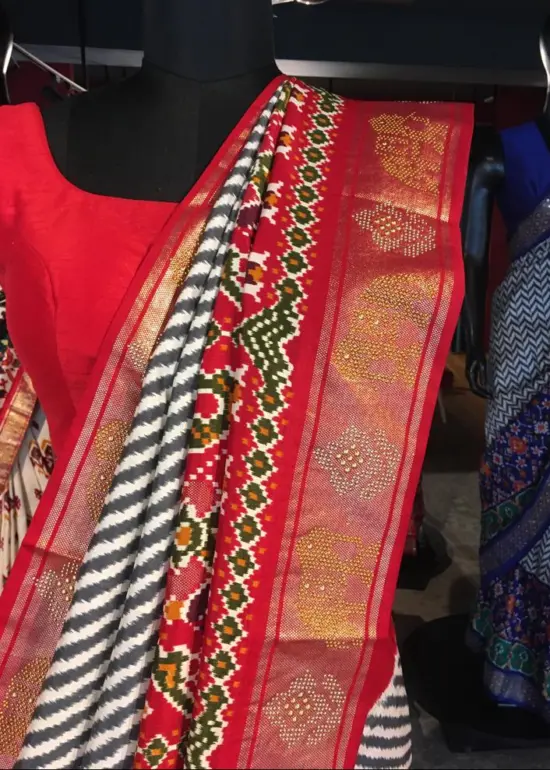 Offwhite Banarasi Soft Silk Saree highlighted with Patola Weaves