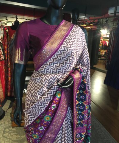 Offwhite Banarasi Soft Silk Saree highlighted with Patola Weaves