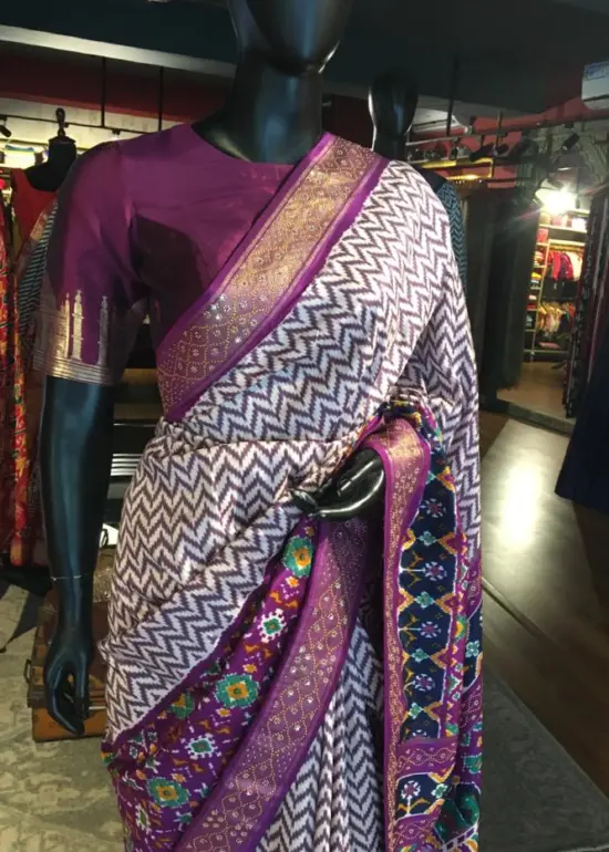 Offwhite Banarasi Soft Silk Saree highlighted with Patola Weaves