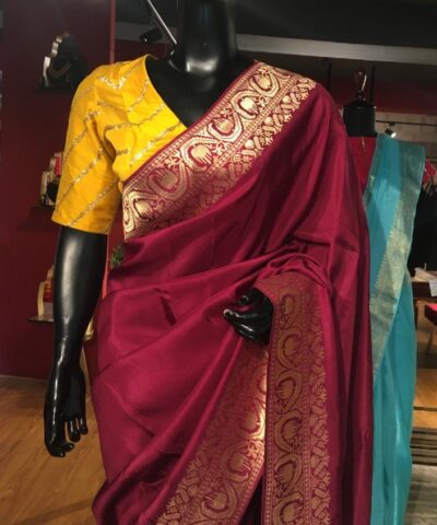 Burgundy  Dola Silk Saree highlighted with Gold Zari Border