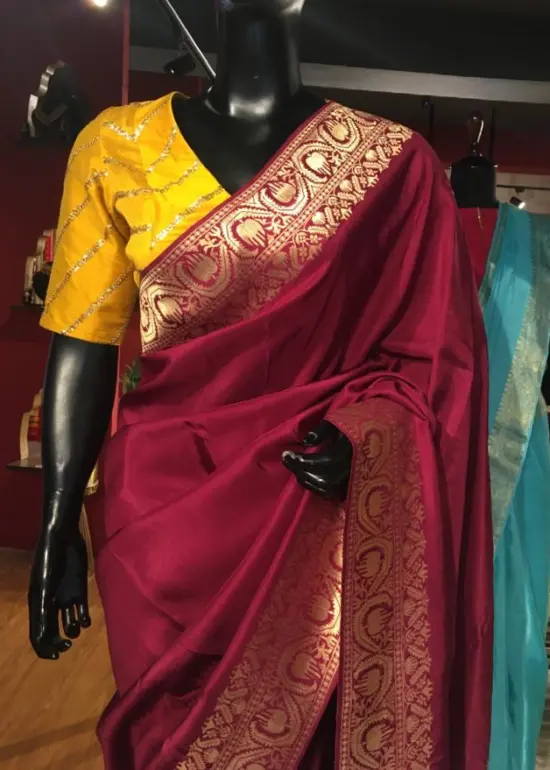 Burgundy  Dola Silk Saree highlighted with Gold Zari Border