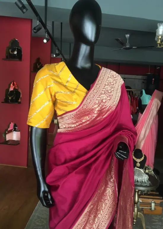 Burgundy Dola Silk Saree highlighted with Gold Zari Border