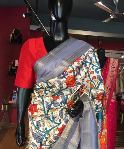 Off White Printed Banarasi Silk Saree highlighted with contrast border