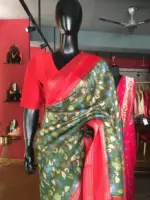 Green Printed Banarasi Silk Saree highlighted with contrast border