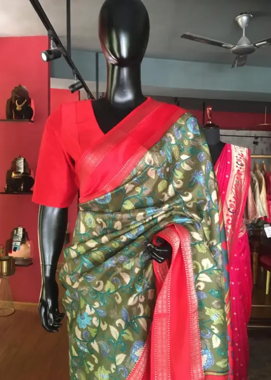 Green Printed Banarasi Silk Saree highlighted with contrast border