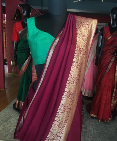 Burgundy Dola Silk Saree highlighted with Gold Zari Border